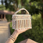 Side view of the Adira bag showing its 2.7-inch depth and structured rectangular frame.