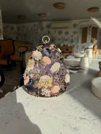 The clutch styled with a wristlet option for casual evening carry.