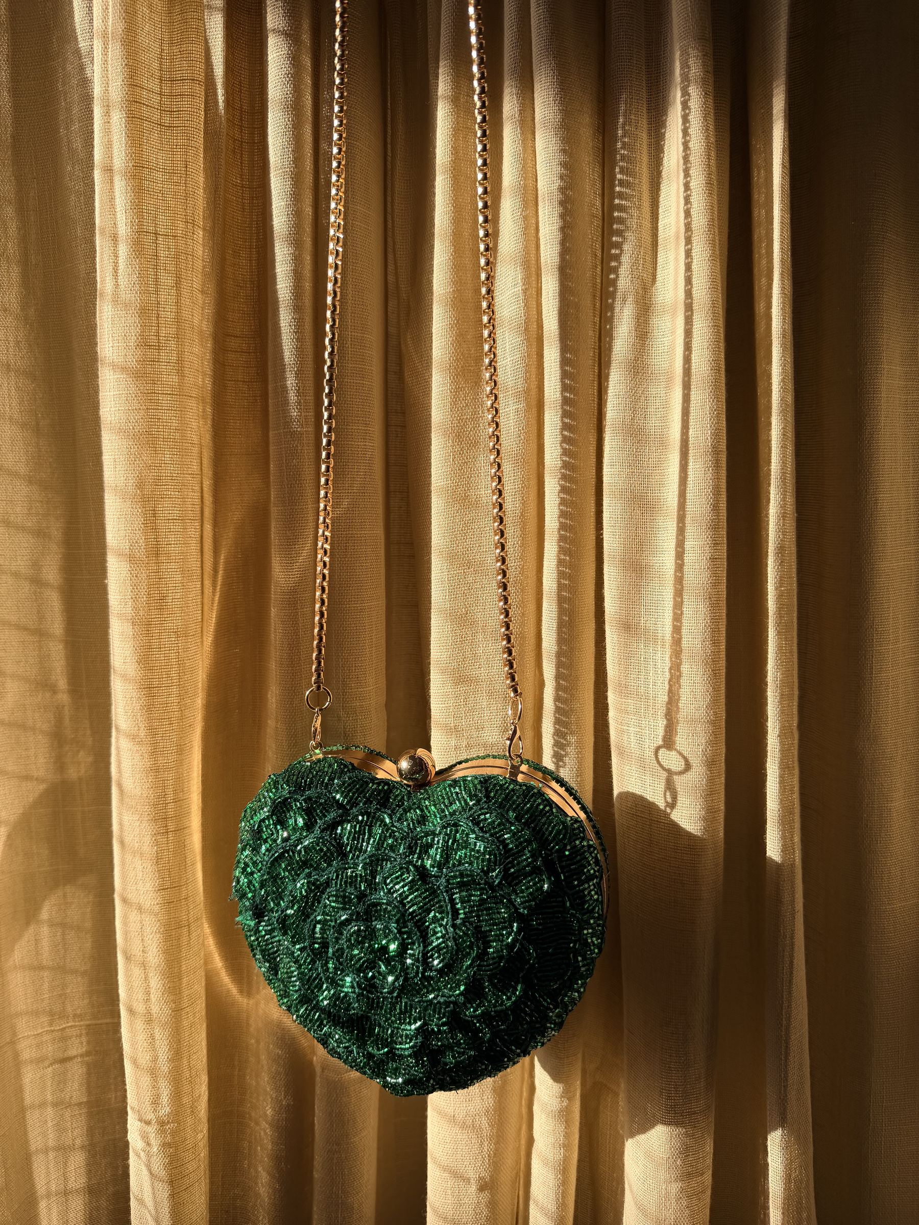 The Amour Beaded Clutch displayed with romantic decor, highlighting its Valentine theme.