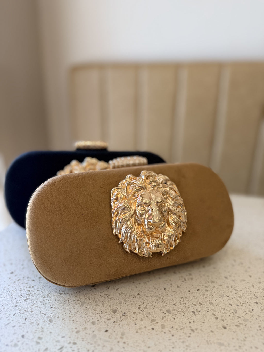 Front view of the Aurelia clutch, illustrating its structured rectangular silhouette.