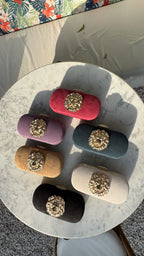 The Aurelia clutch collection displaying multiple vibrant shades side-by-side.