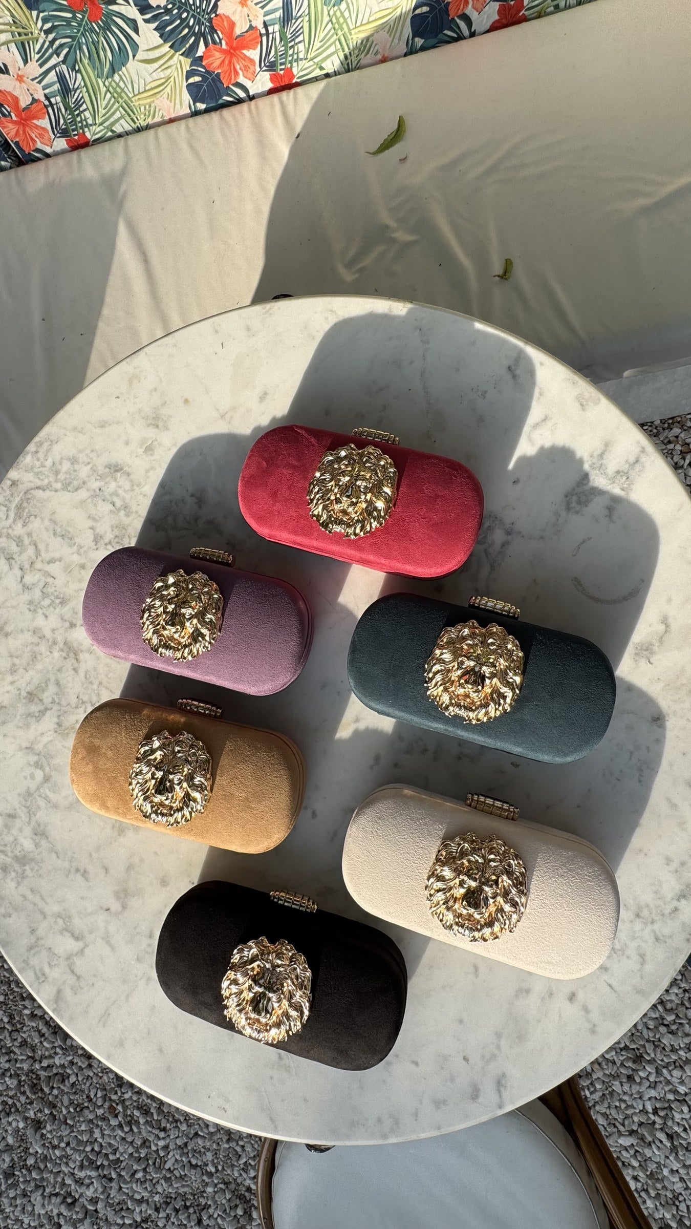 The Aurelia clutch collection displaying multiple vibrant shades side-by-side.