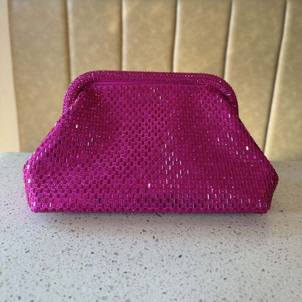 Side view of the Aurelle clutch showing its 11-inch length and slim, elegant depth.