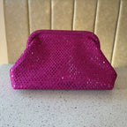 Side view of the Aurelle clutch showing its 11-inch length and slim, elegant depth.