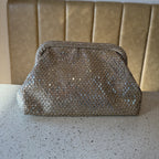 Close-up of the gold clasp mechanism on the Aurelle statement bag.