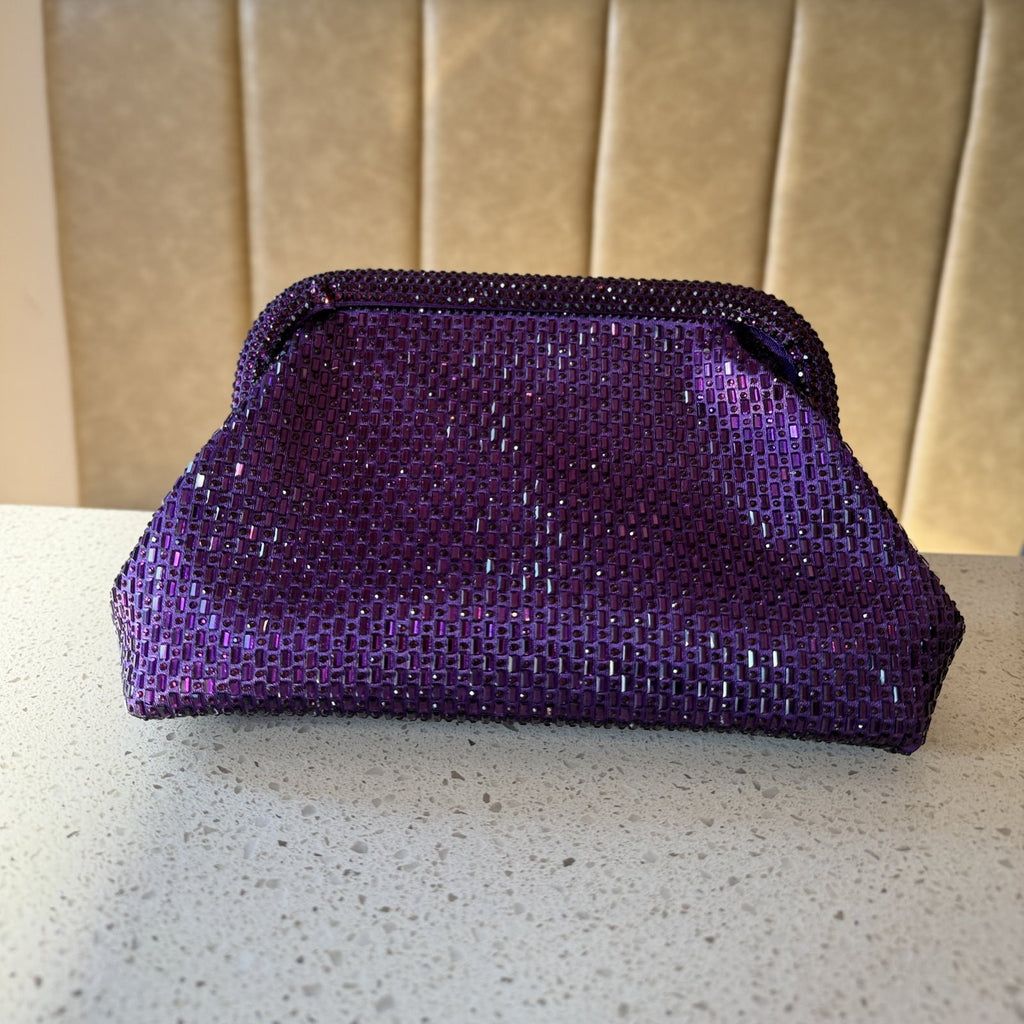 Rear view of the Aurelle clutch showcasing the clean, consistent golden texture.