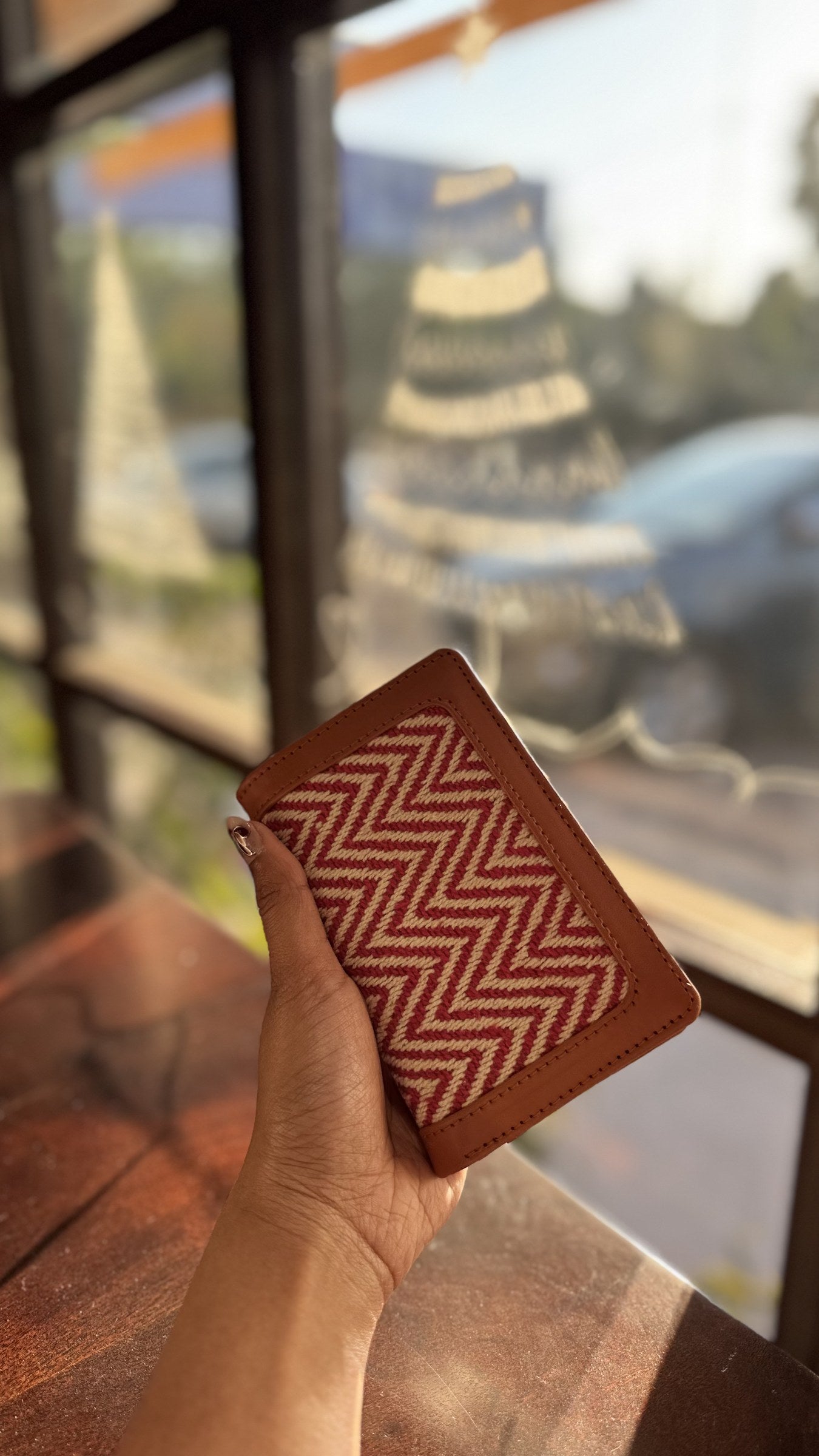 Cardo tan leather card holder showing the front panel with multiple card slots and clean minimalist stitching.