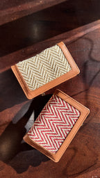 Detail shot of the hand-painted edges and tan leather texture of the Cardo slim wallet.