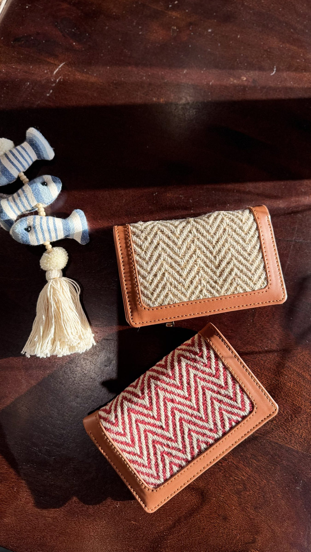 Cardo slim wallet in tan leather showing cards partially inserted into the slots.