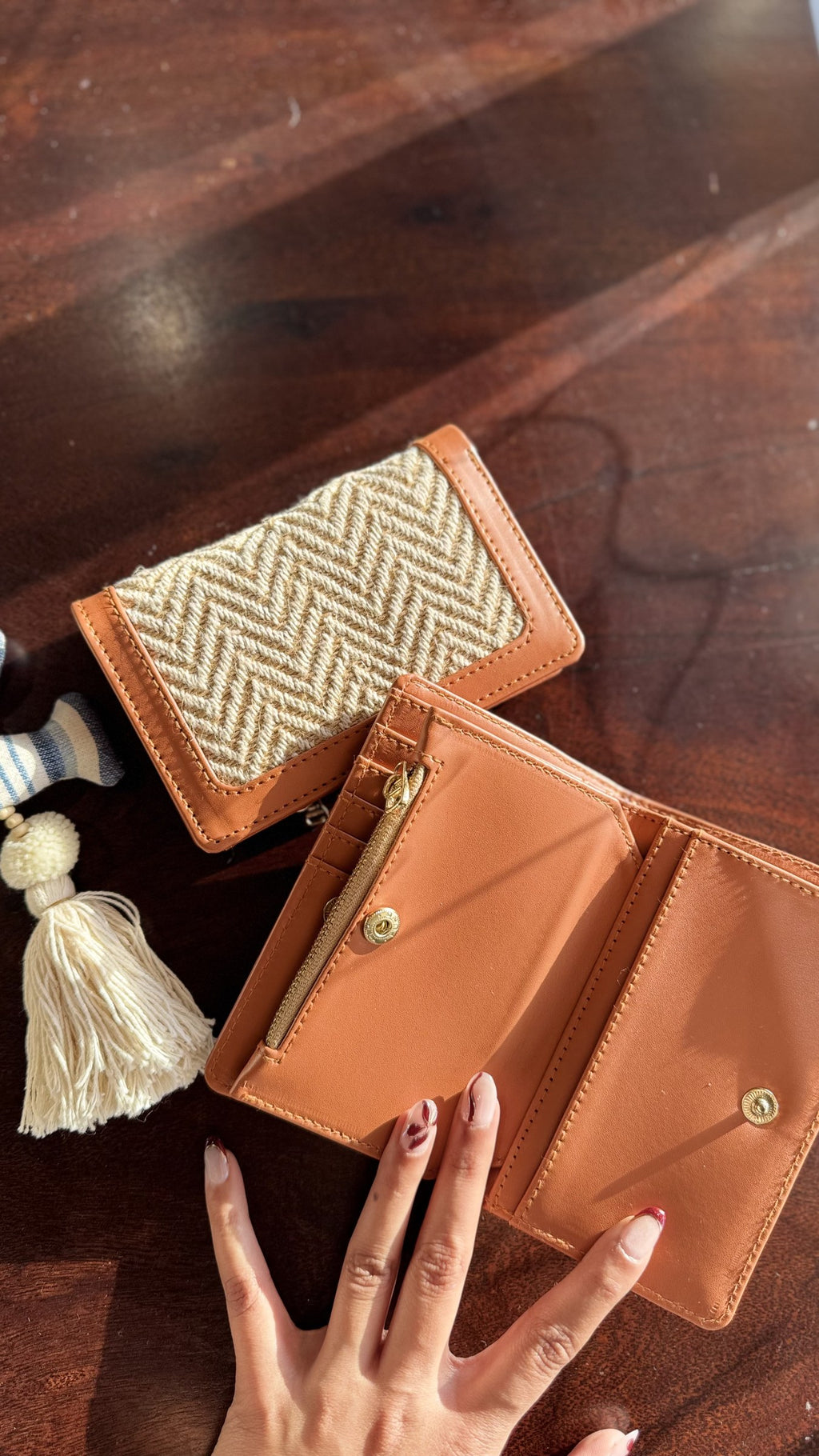 Cardo wallet held in hand to showcase its compact size and practical daily use appeal.
