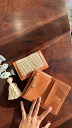 Angle view of the Cardo wallet highlighting the premium leather grain and brown edge finish.