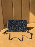 The Celebration Capsule clutch styled with a luxury pastel wedding gown.