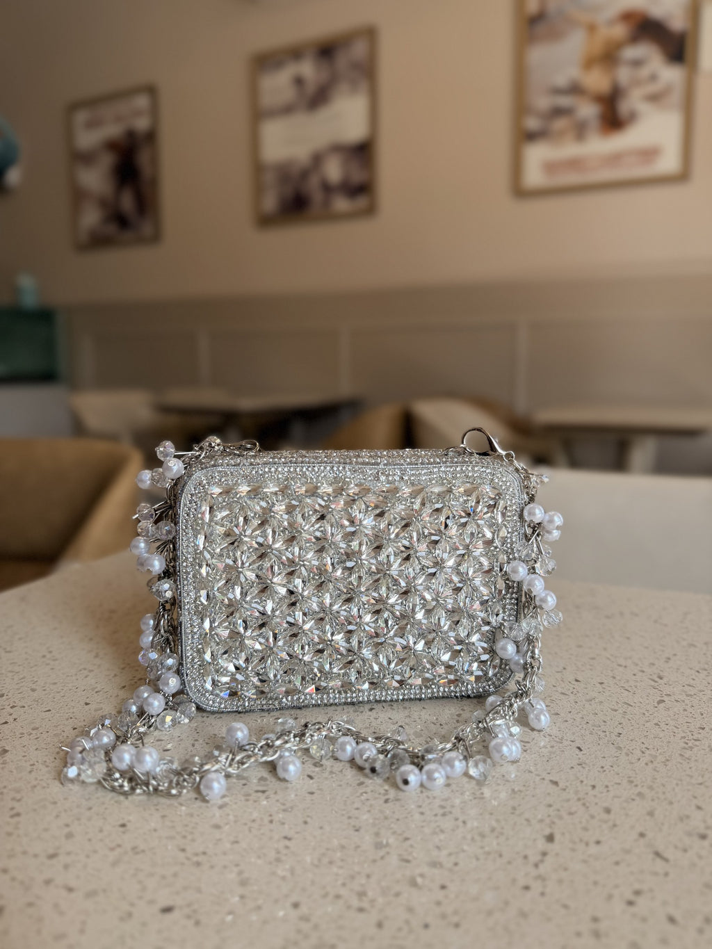 Open view of the mini bag illustrating its satin lining and capacity for cards and lip gloss.