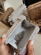 Flat lay of the Champagne Crush mini showing the gold-tone sling chain attached.
