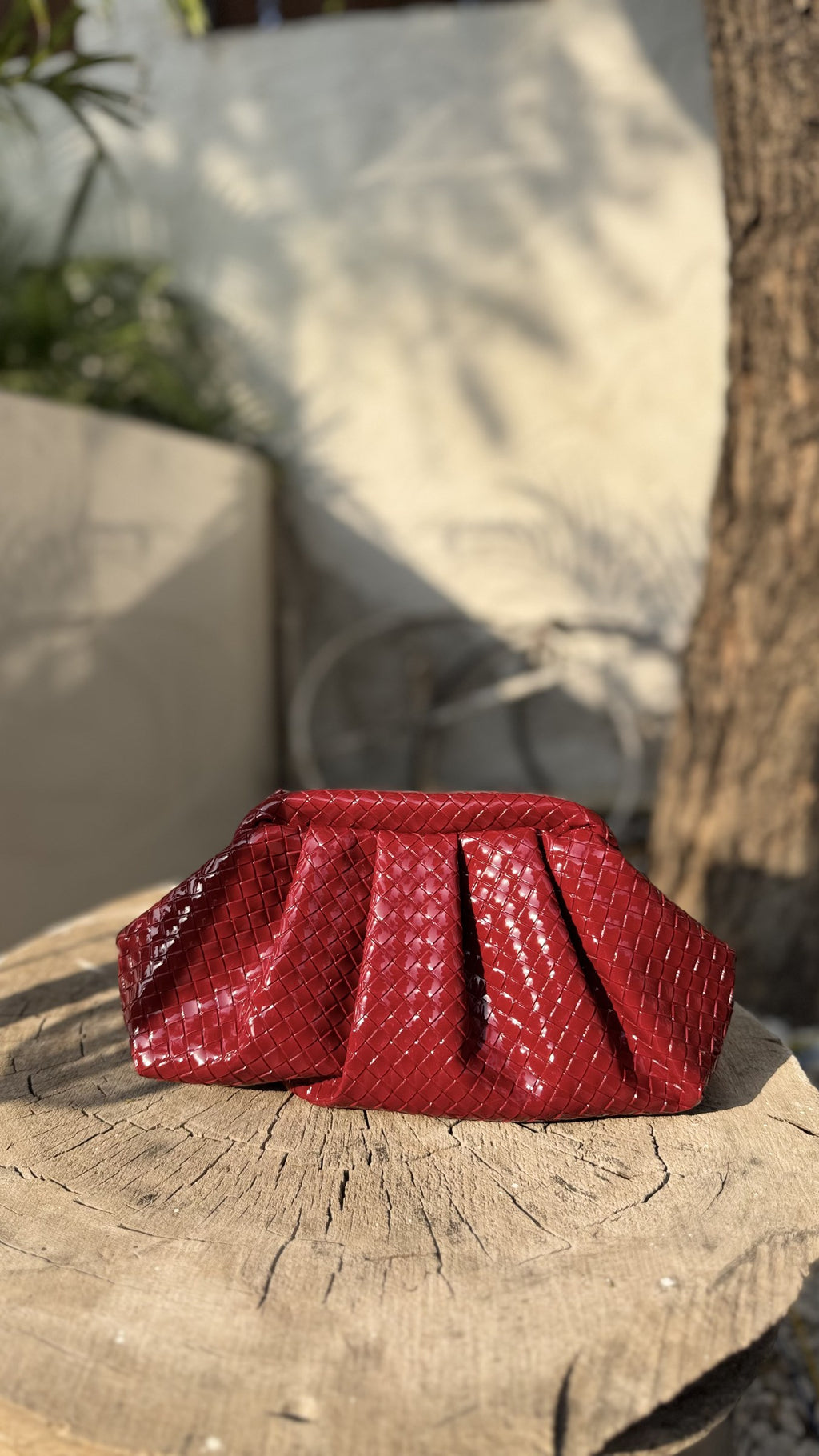 Detail view of the red stitching pattern on the white fabric.