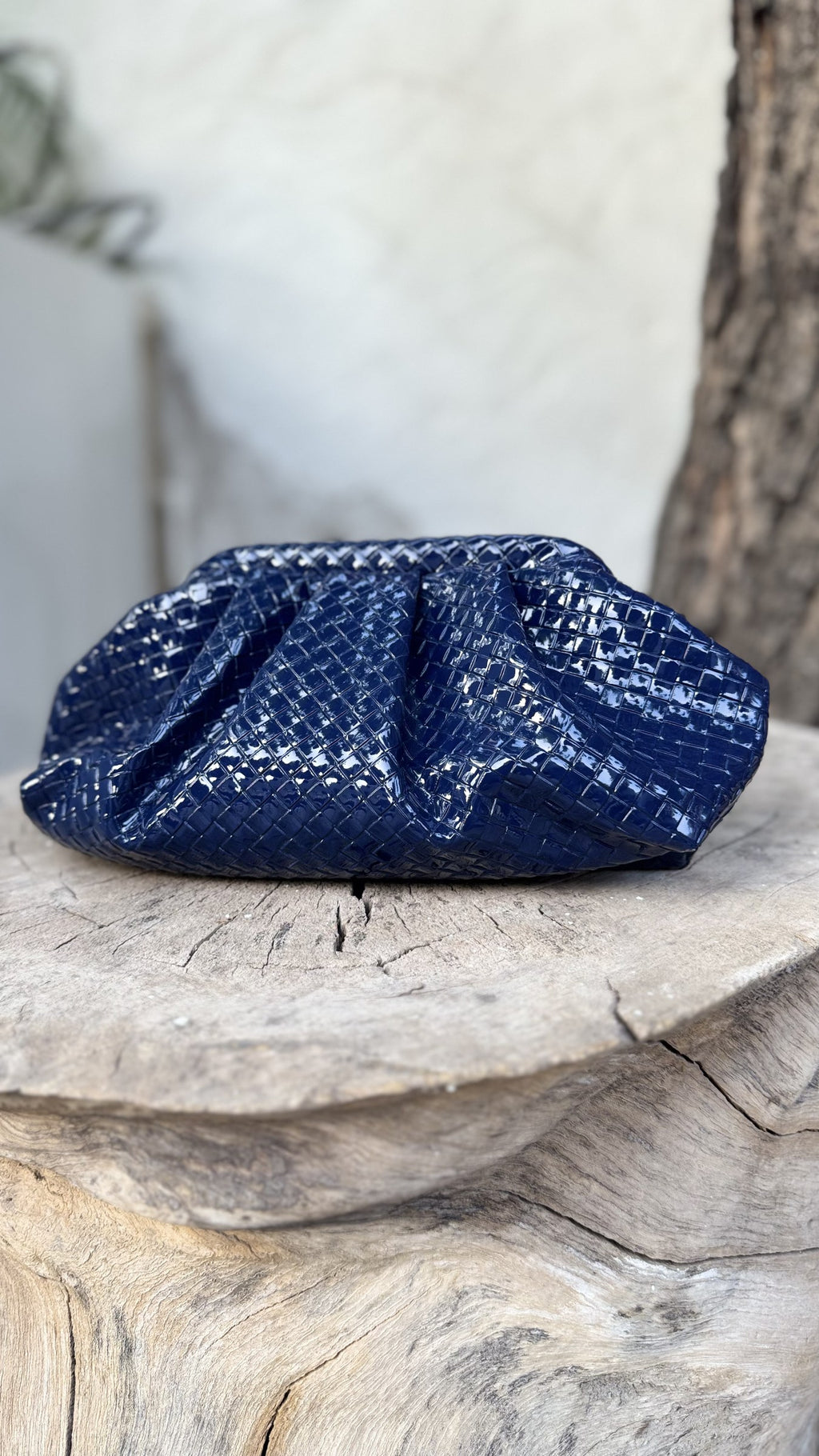 Criss Cross holiday bag held by a model showcasing its hand-carry comfort.