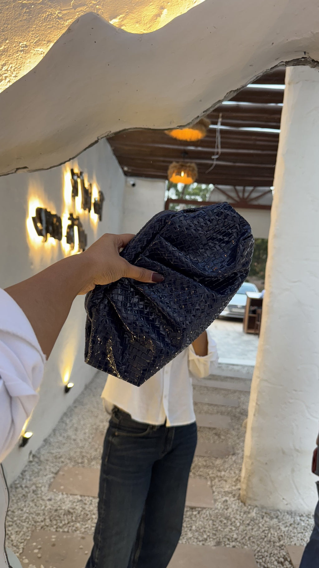 Model styling the bag as a high-shoulder carry.