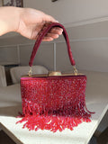 Crystal Fringe satin evening clutch displaying its shimmering clear crystal fringes and short handle.
