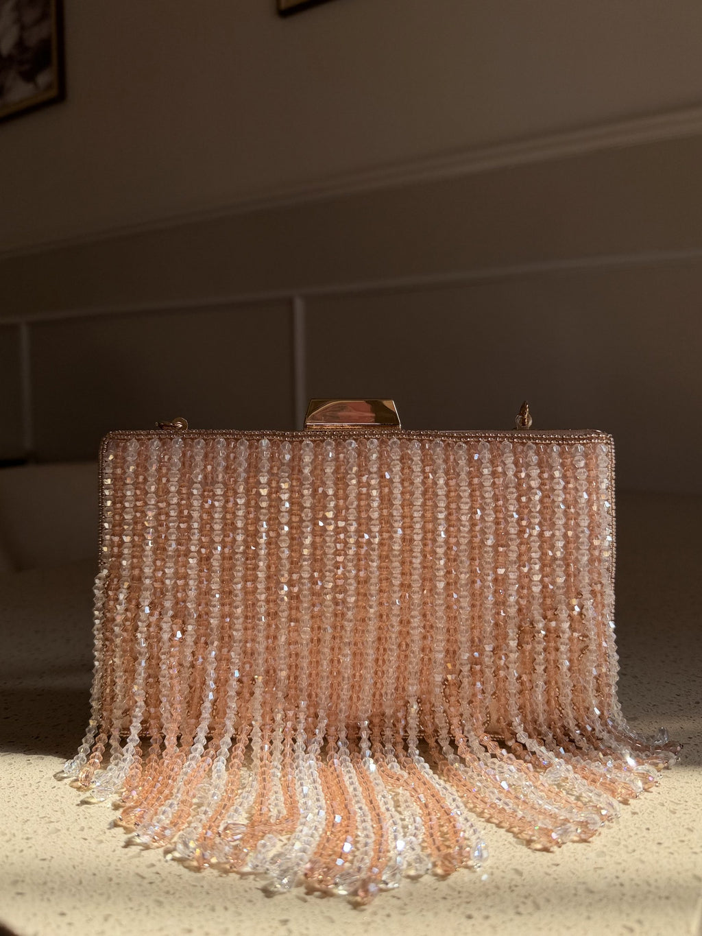 Side profile of the Crystal Fringe clutch showing its structured rectangular depth.