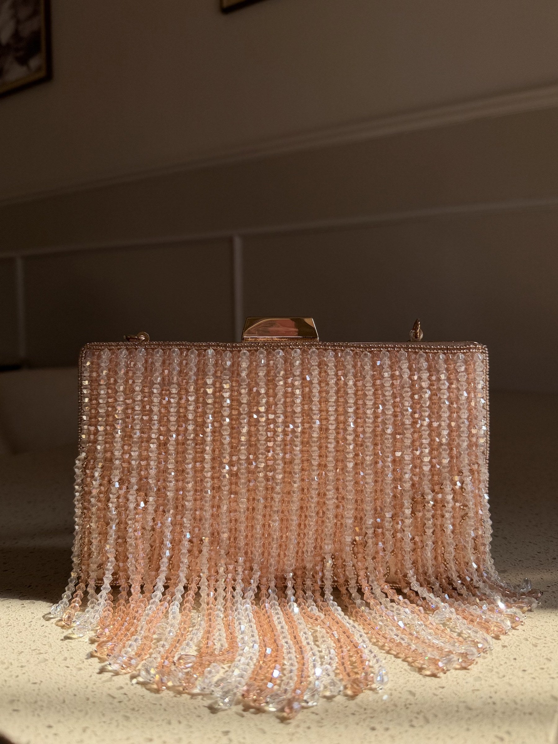 Side profile of the Crystal Fringe clutch showing its structured rectangular depth.