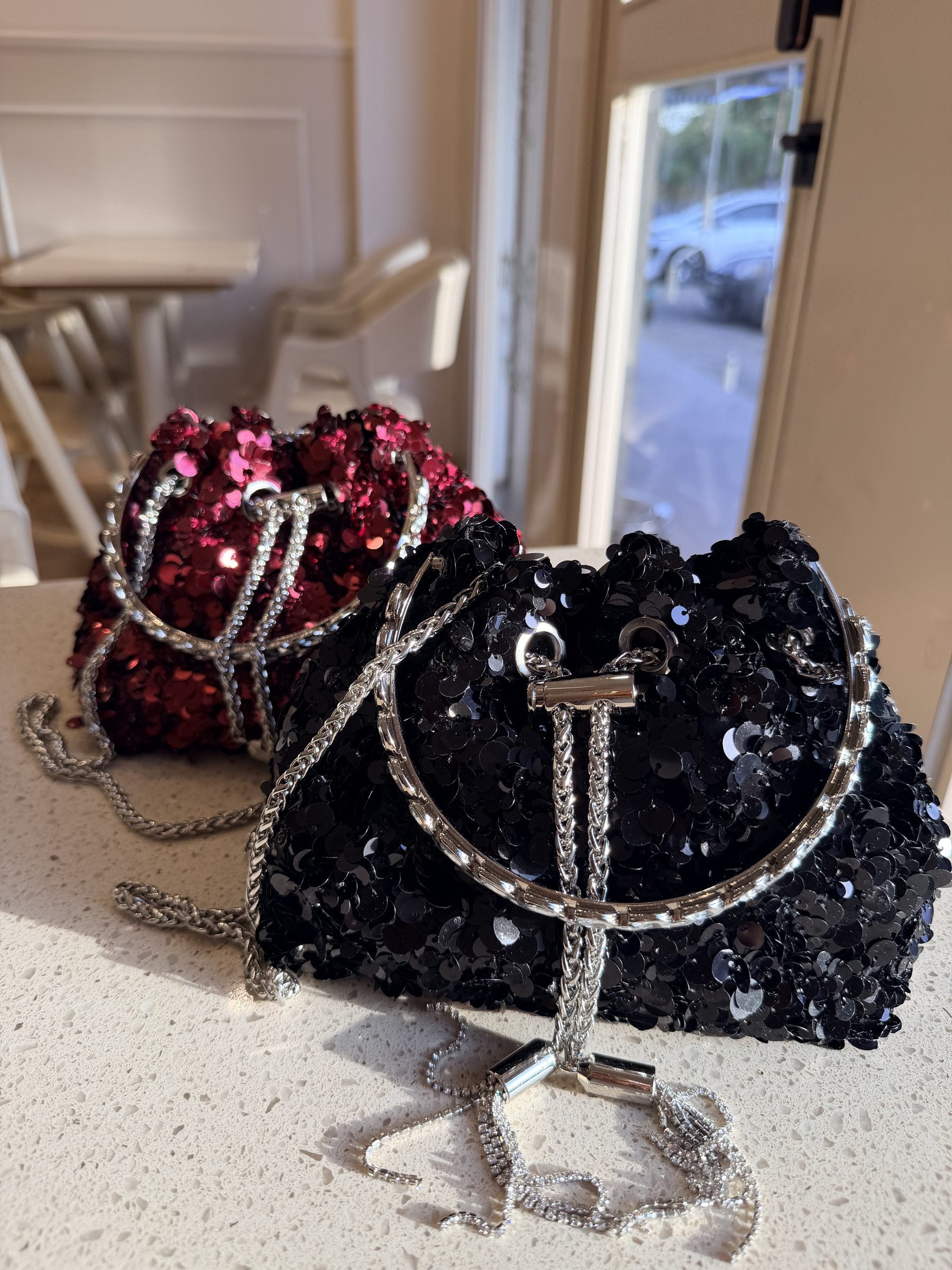 Flat lay of the Disco Dust bag displayed with party accessories and a smartphone.