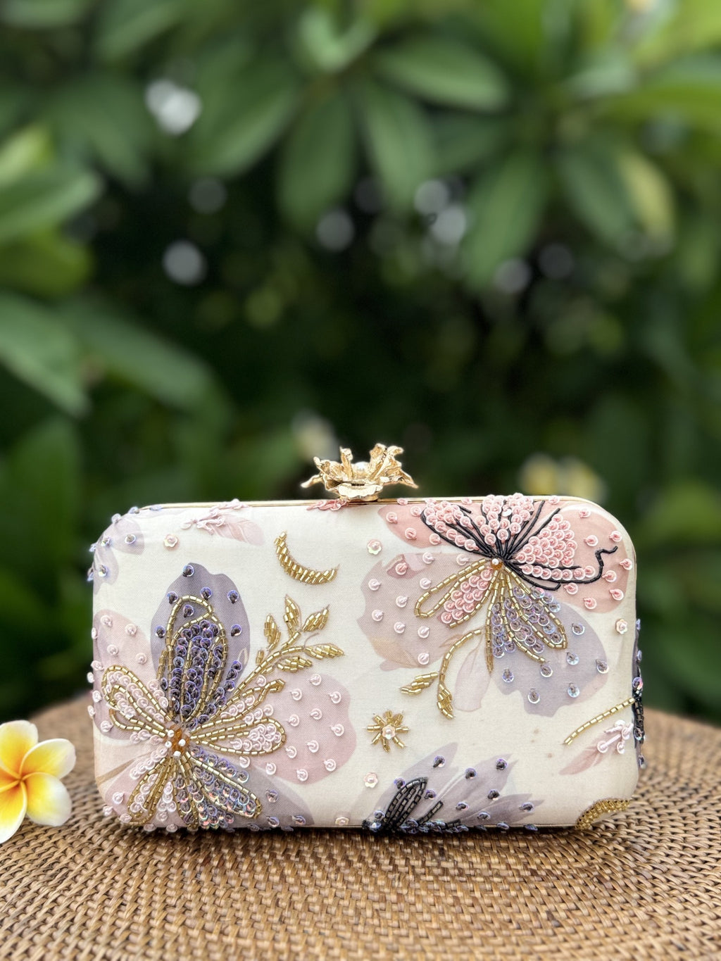 The clutch styled handheld to illustrate compact evening proportions.