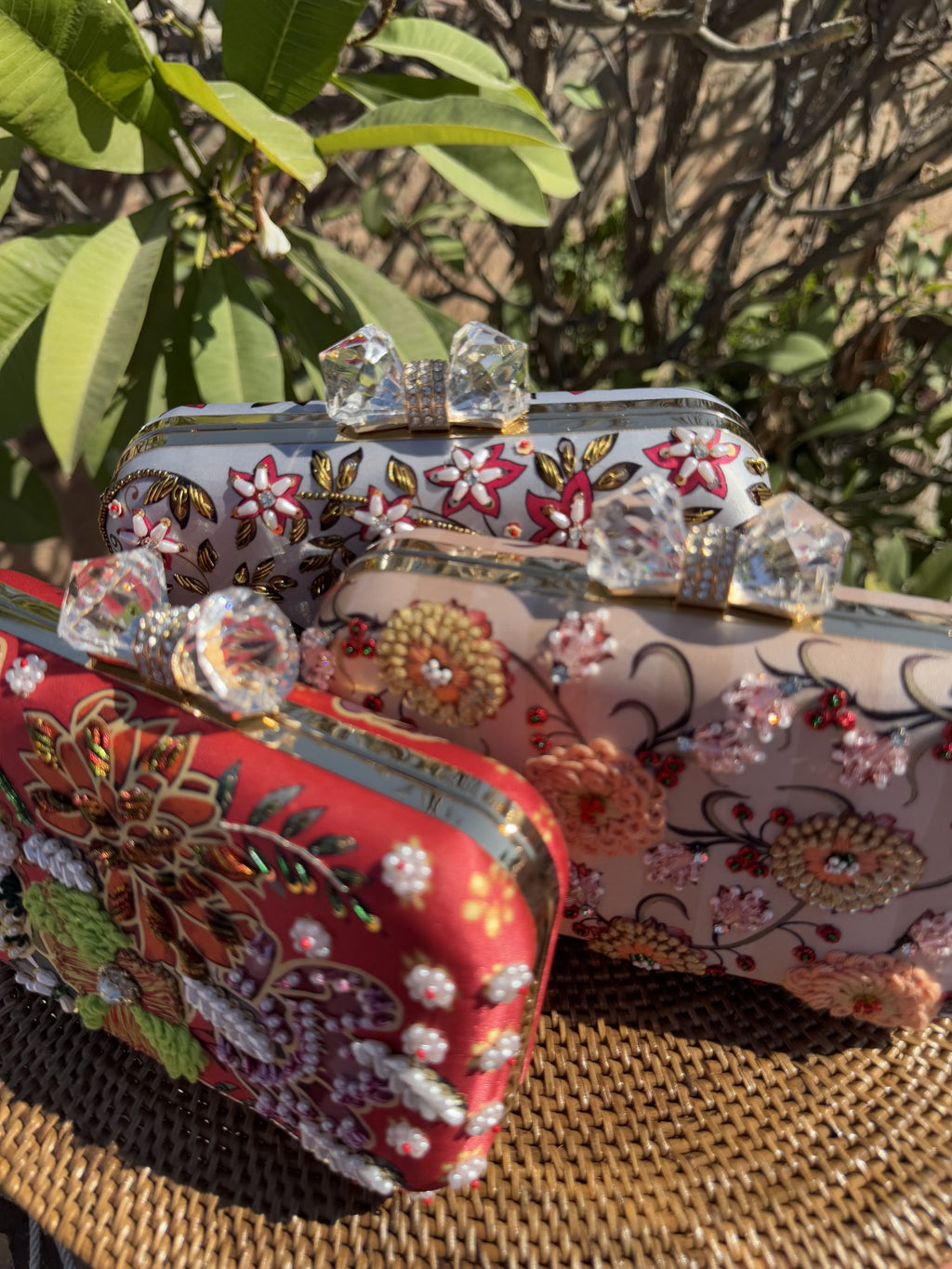 Model styling the 8 by 4 clutch with a cocktail dress for party wear.