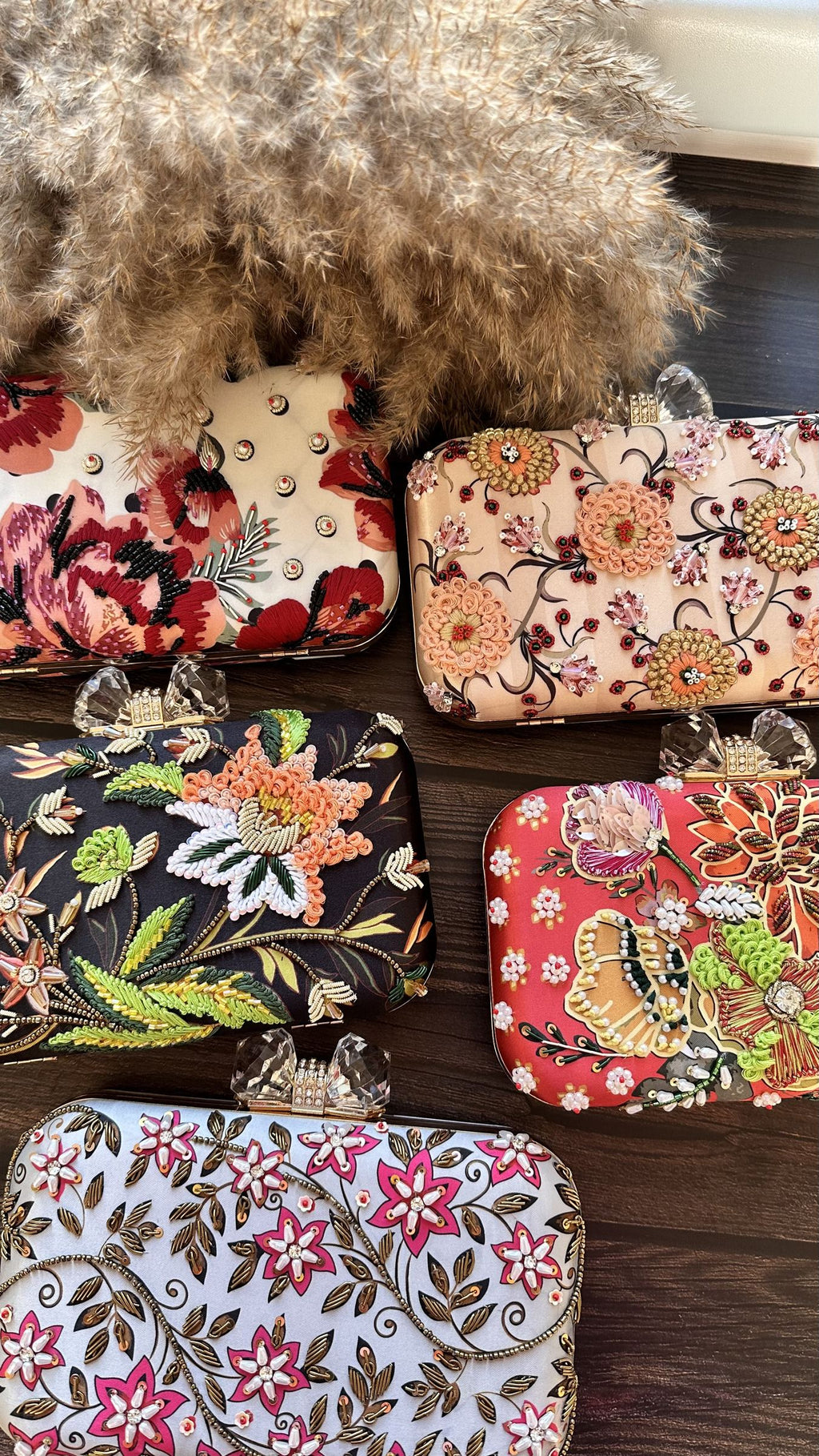 Eight-by-Four clutch styled next to cosmetics in a lifestyle layout.