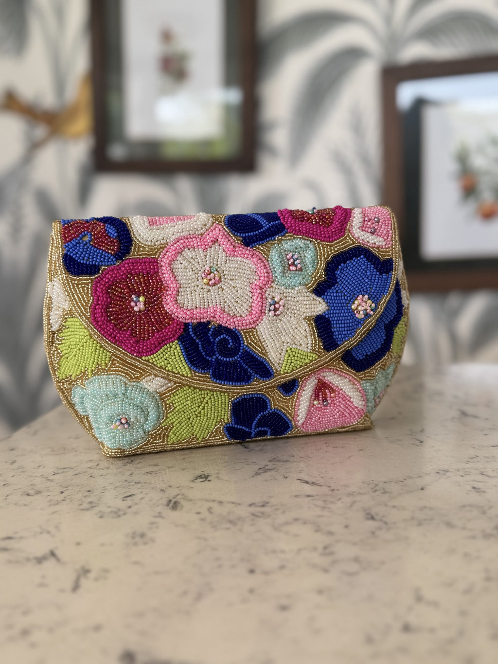 Side angle of the Flora Fiesta bag showing its structured rectangular shape and beaded side panel.