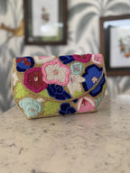 Side angle of the Flora Fiesta bag showing its structured rectangular shape and beaded side panel.