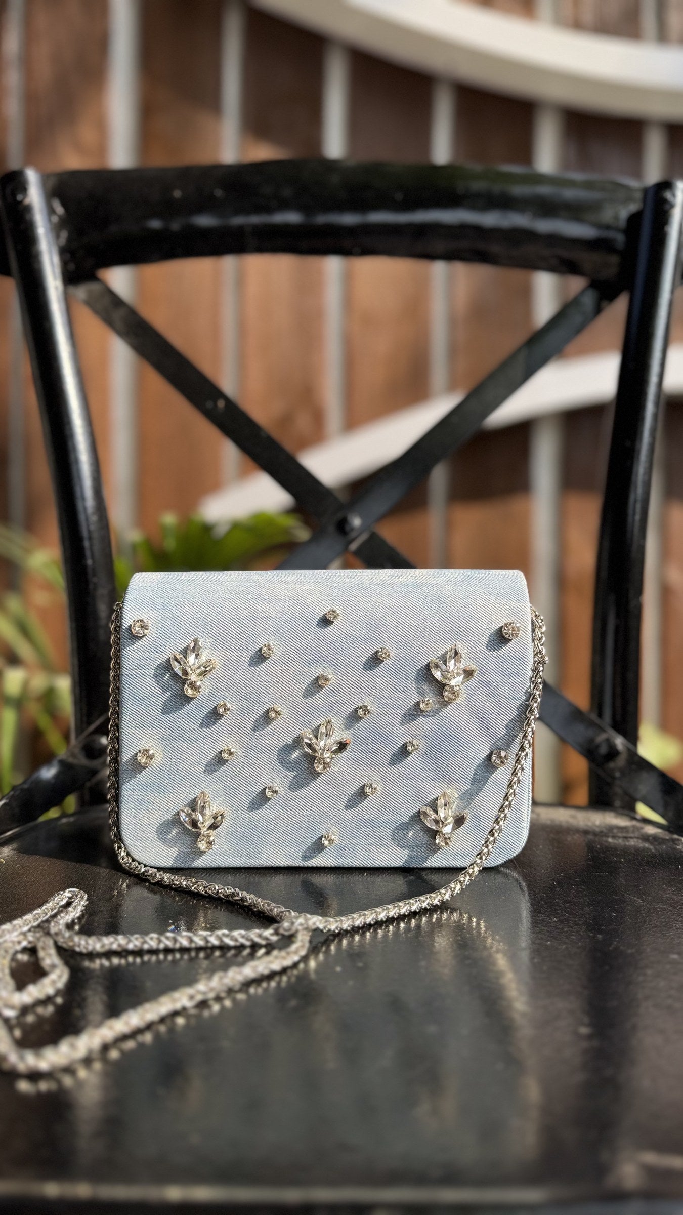 Frosted Denim sling worn cross-body, demonstrating the strap length and casual styling.
