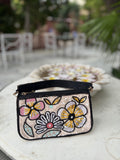 Front view of the Funky Fix Bag showing its vibrant chili pepper appliqué and boxy shape.