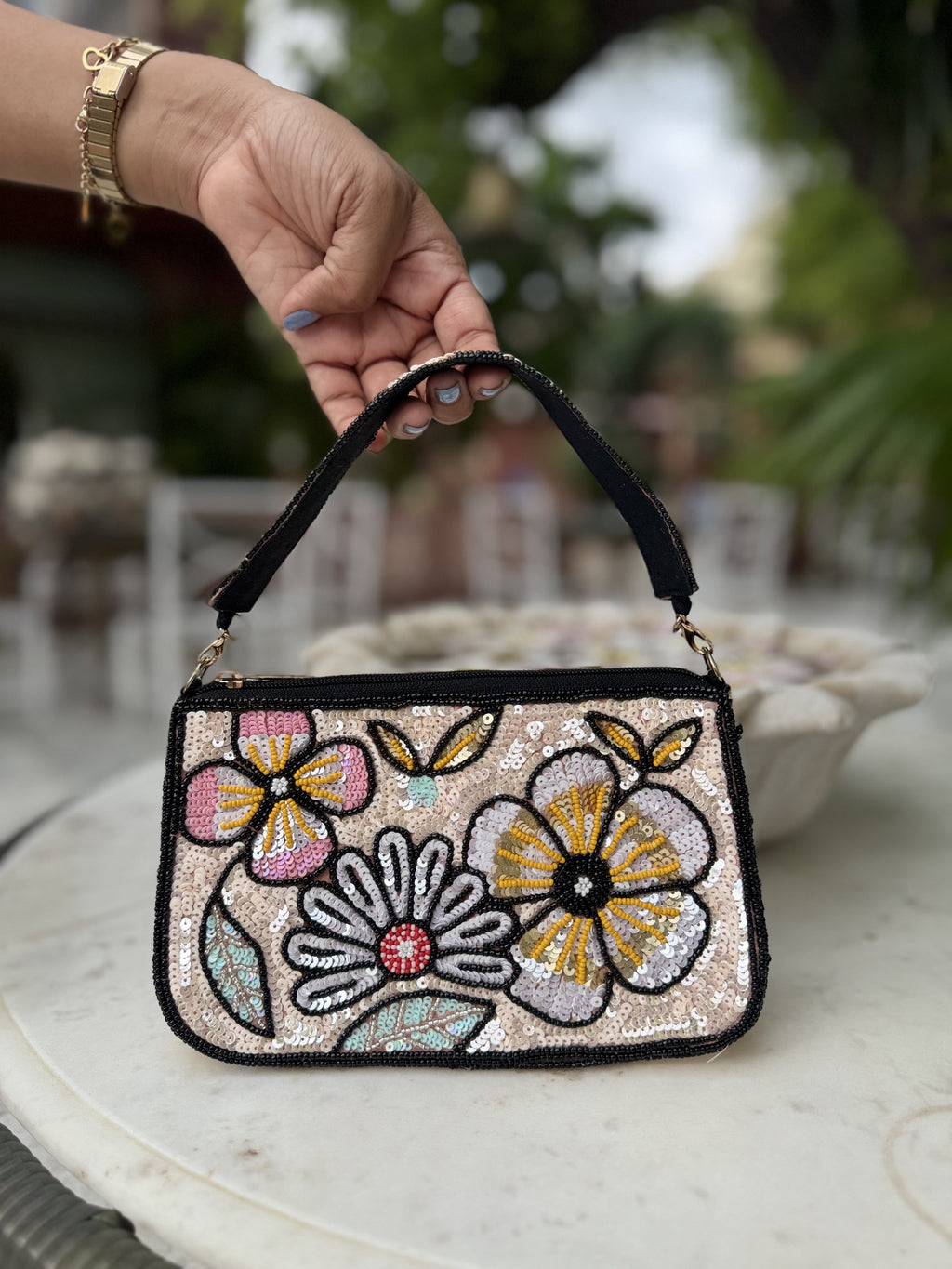 Close-up of the detailed embroidery and fabric texture on the Funky Fix bag.