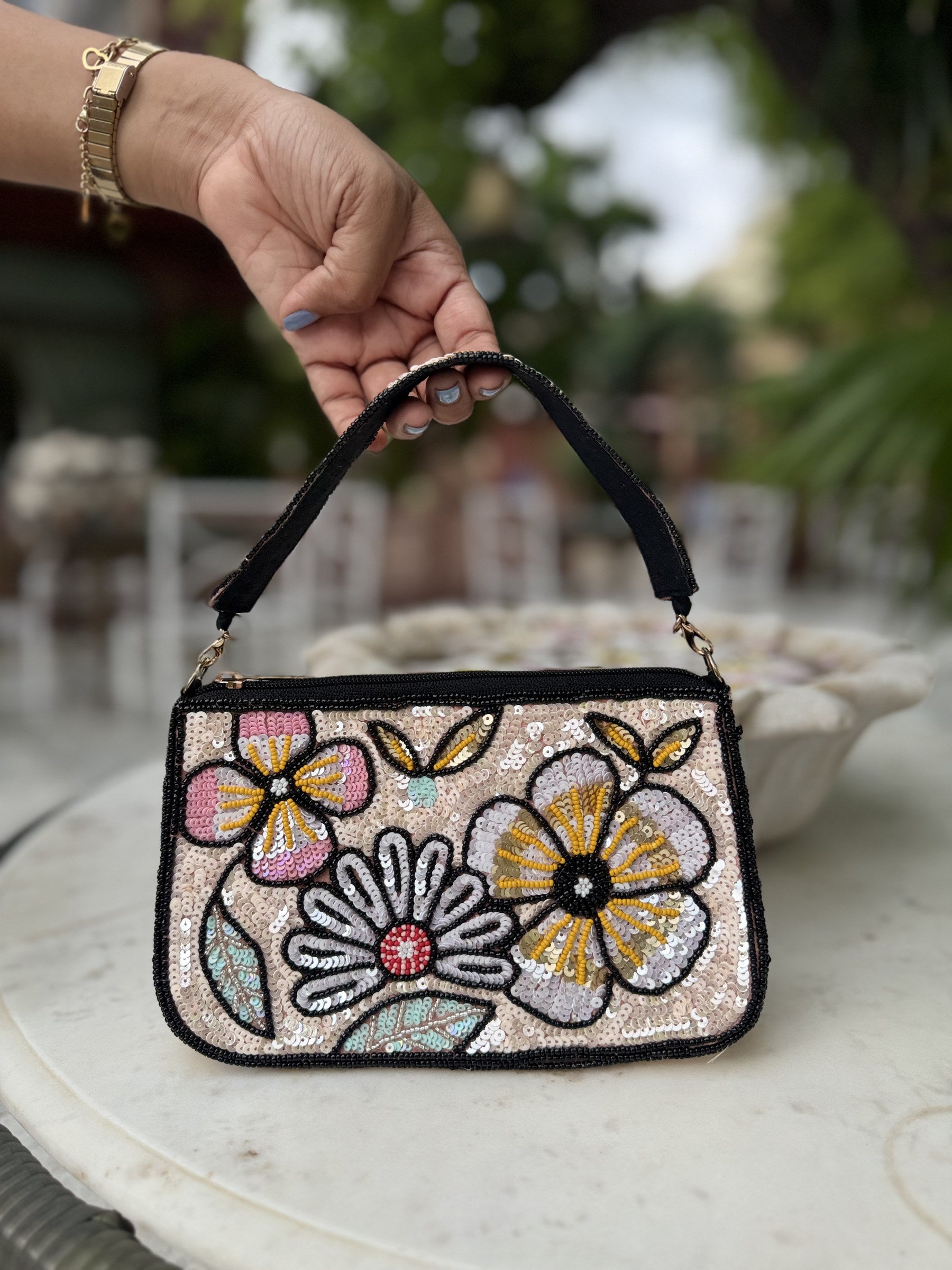 Close-up of the detailed embroidery and fabric texture on the Funky Fix bag.