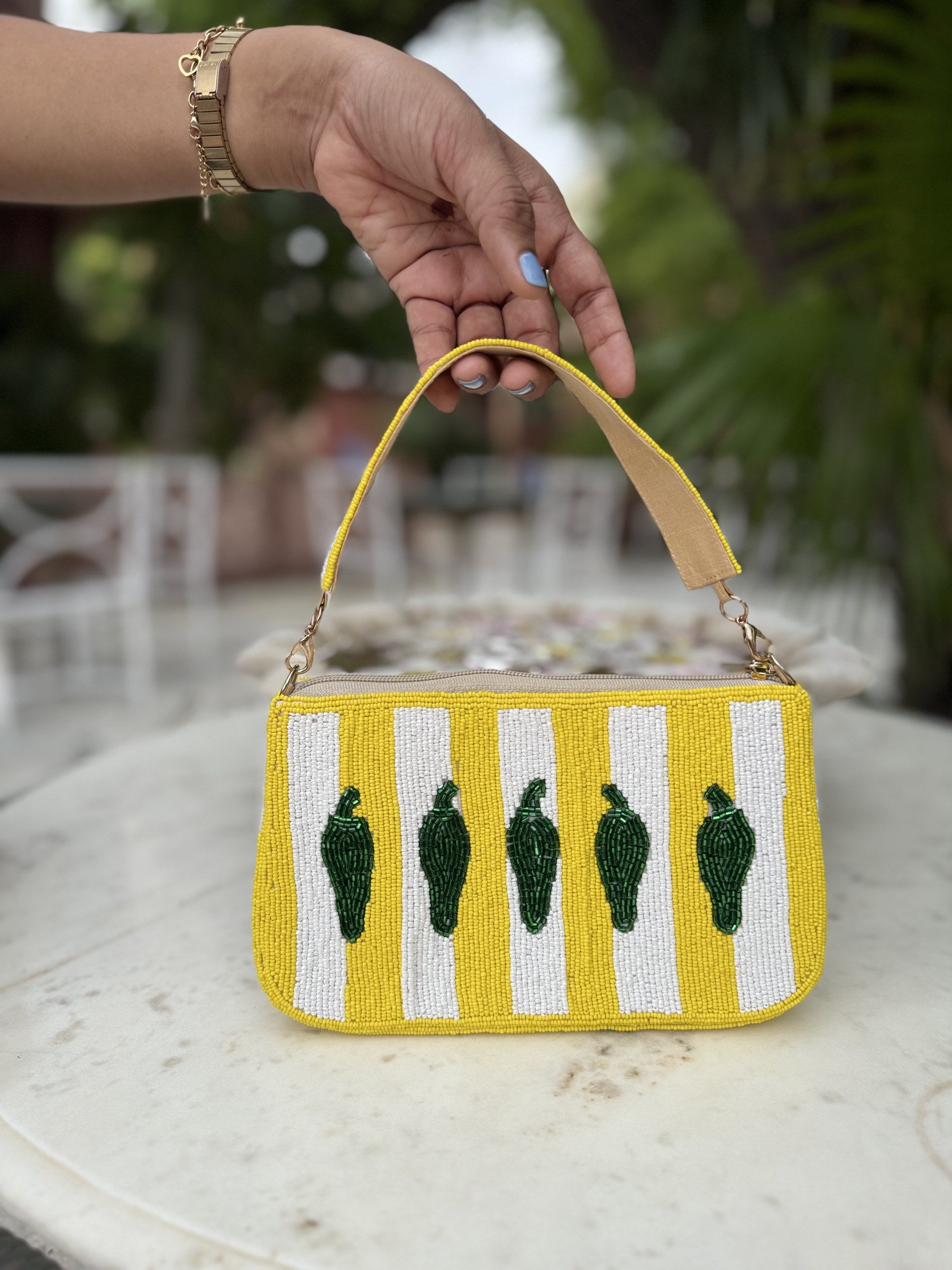 Side panel view of the Funky Fix bag displaying its baguette width and stitching.