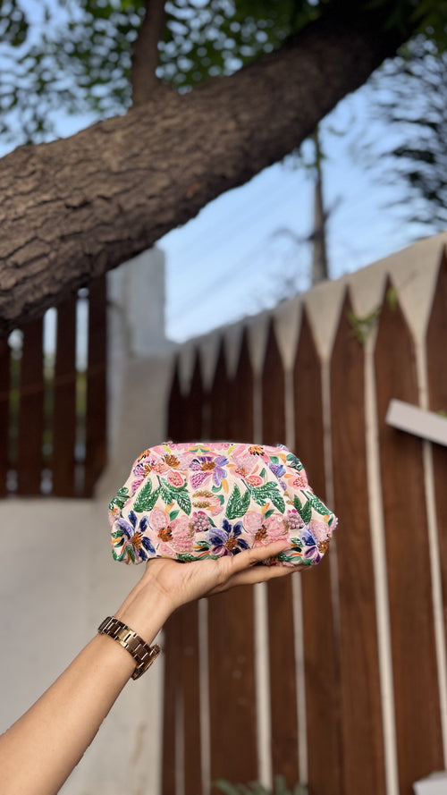 Garden Muse clutch showing the intricate hand embroidery over the digital printed rexine base.