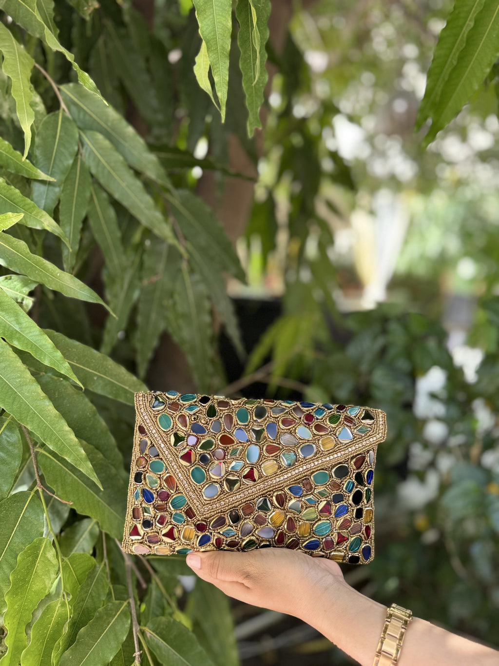 Front profile of the Gemzy flap bag showcasing the symmetry and color distribution of the handwork.