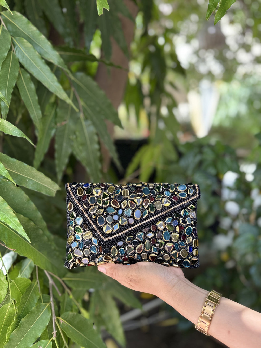 Side view of the structured Gemzy handbag, highlighting its rectangular depth and fabric stitching.