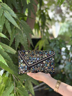 Side view of the structured Gemzy handbag, highlighting its rectangular depth and fabric stitching.