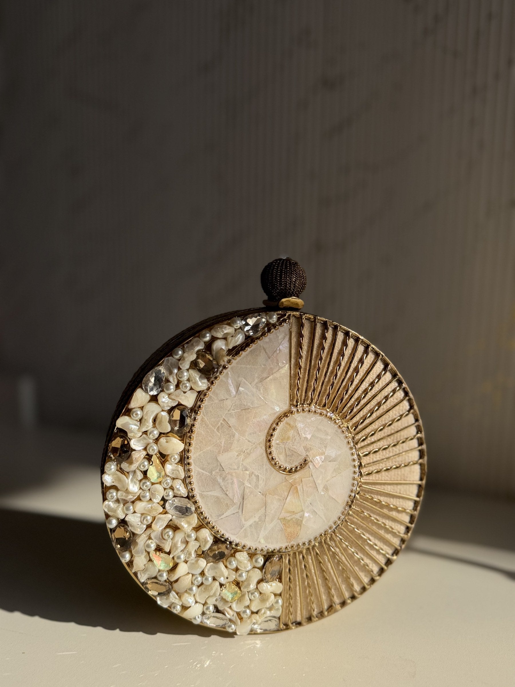 Detailed texture shot of the hand-cast brass finish and polished border lines.
