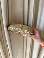 Close-up of the detachable chain connection on the brass loop.
