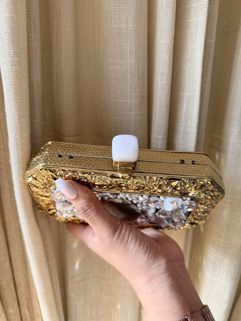 The Gilded Muse collection featuring rectangular, oval, and round silhouettes in gold.