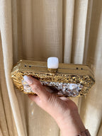 The Gilded Muse collection featuring rectangular, oval, and round silhouettes in gold.