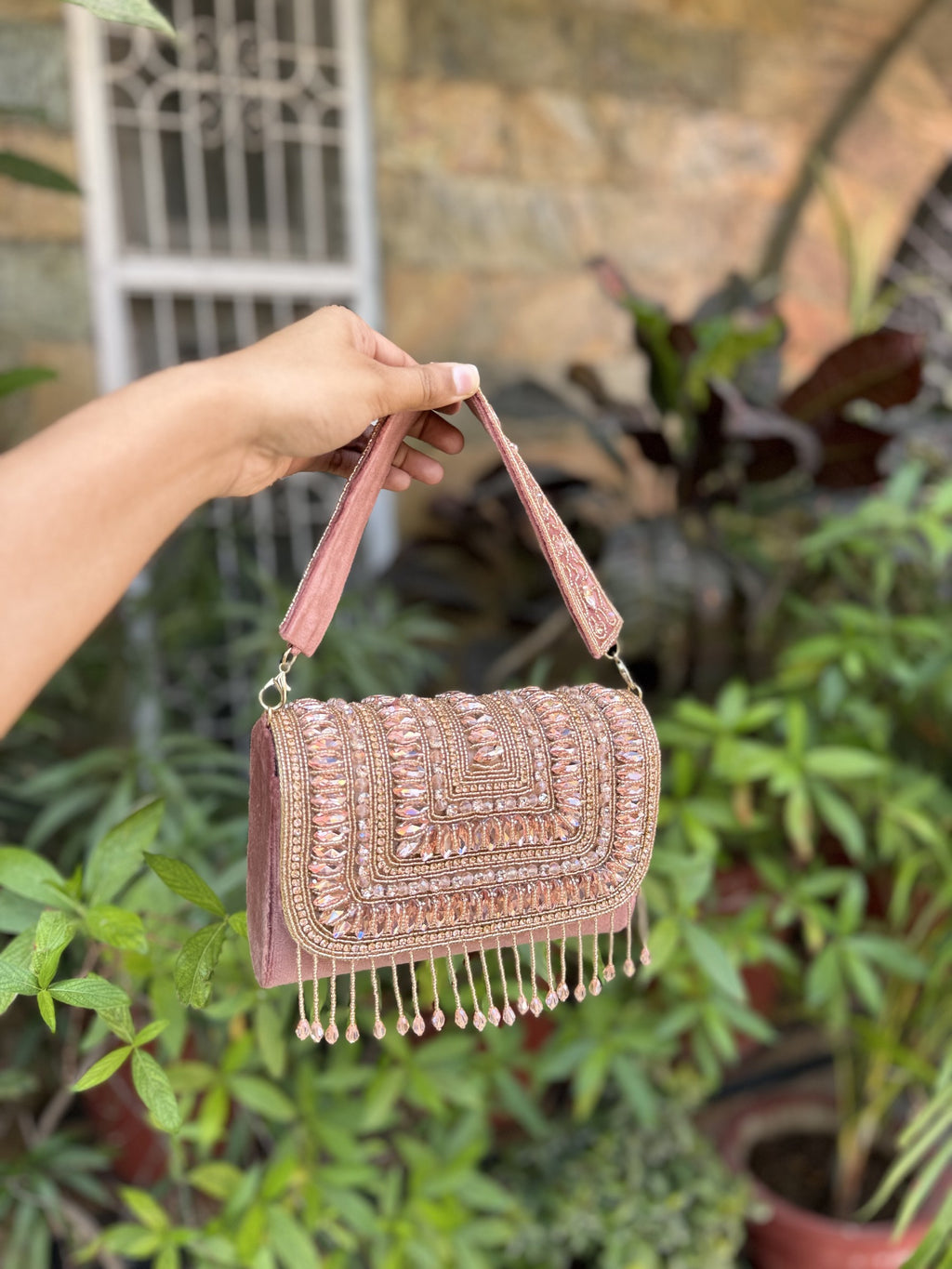 Front view of the Glimmer Grip clutch, highlighting its structured rectangular box shape.
