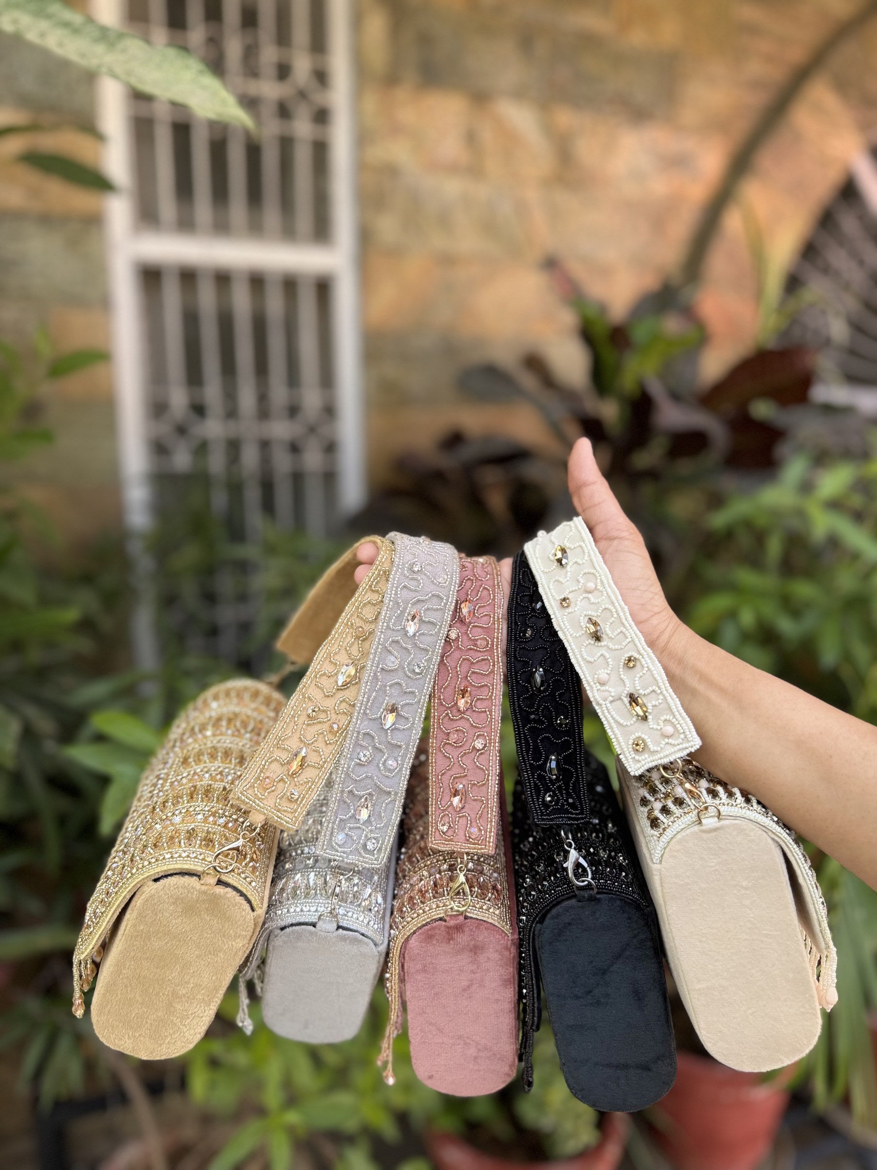 Open view of the Glimmer Grip handbag displaying the fabric lining and clasp lock.