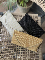 Detailed view of the linear grainline beadwork and matching beaded wrist handle.