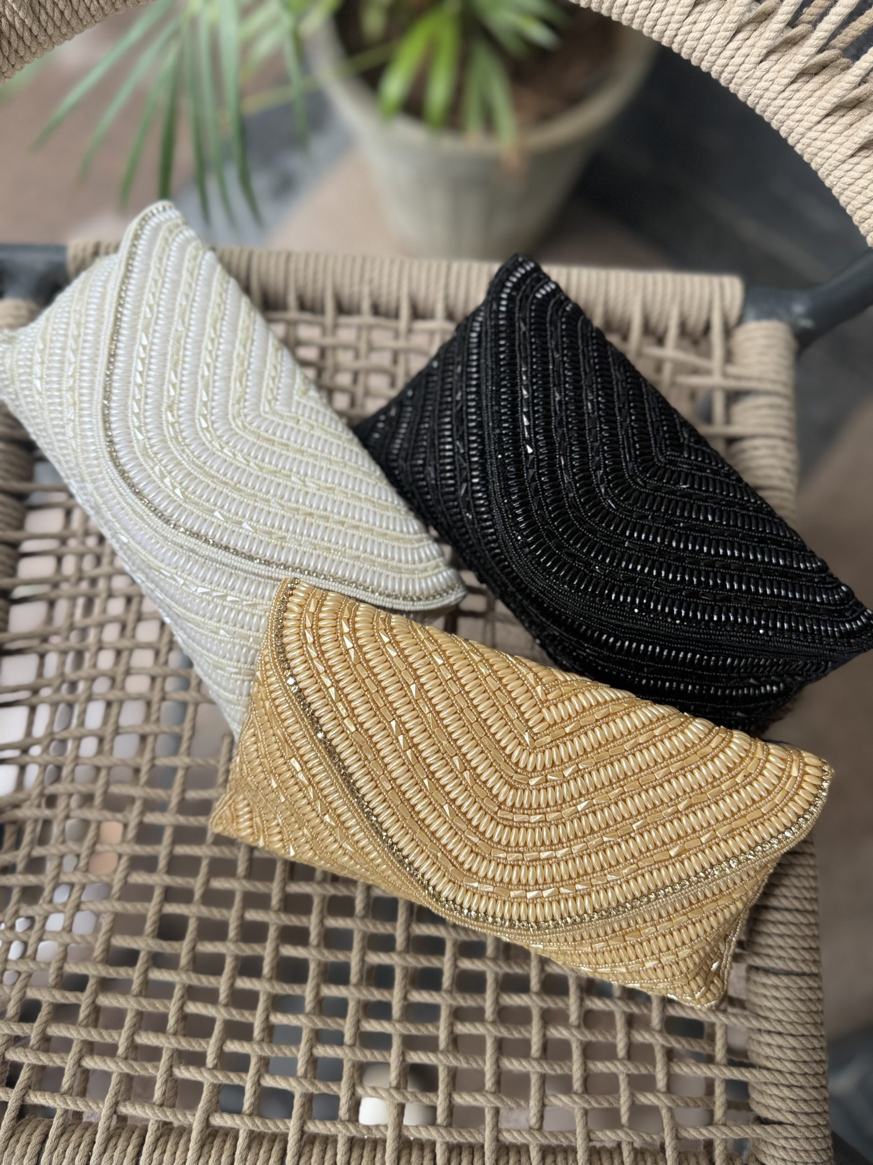 Detailed view of the linear grainline beadwork and matching beaded wrist handle.