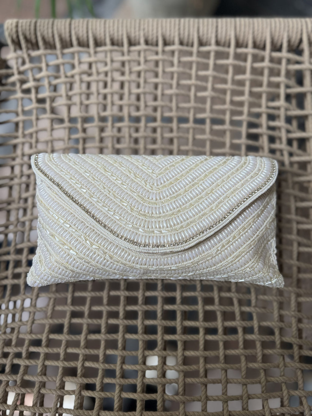 The Grainline flap bag in radiant gold, showcasing the metallic shimmer of its parallel beads.