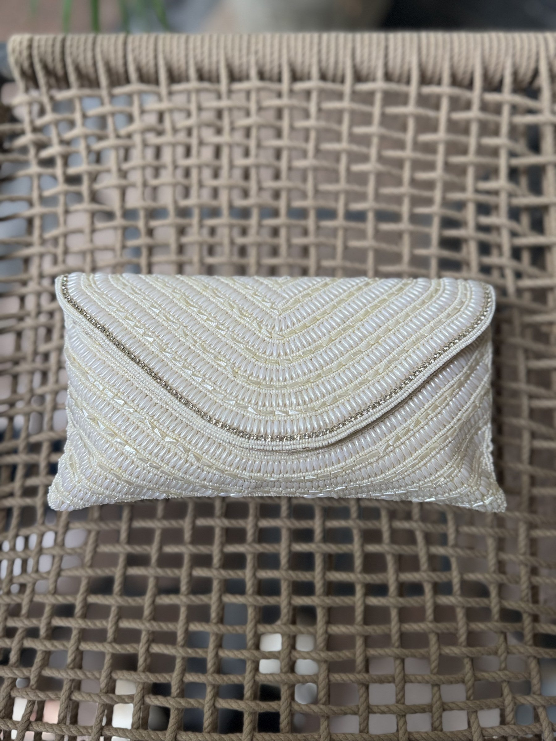 The Grainline flap bag in radiant gold, showcasing the metallic shimmer of its parallel beads.