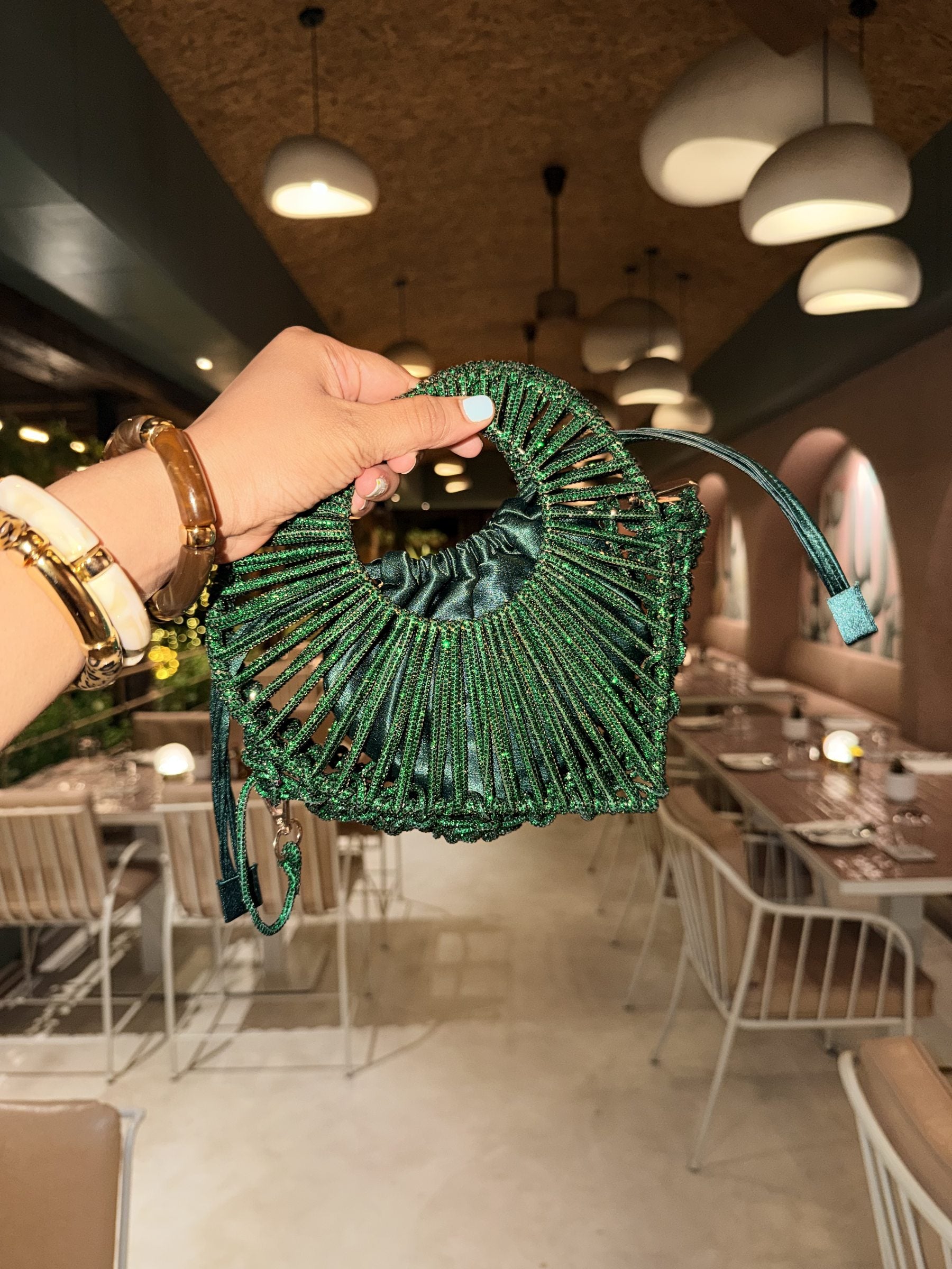 Front view of the Halo Heart Sparkle Bag, displaying its dense silver-multicolor glitter surface and iconic heart silhouette.